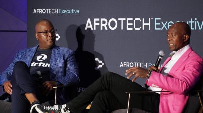 BROOKLYN, NEW YORK - SEPTEMBER 22: Co-Founder/CEO for Zirtue Dennis Cail and Chief Audit Executive Northwestern Mutual Abim Kolawole speaks onstage during AfroTech Executive Brooklyn at William Vale Hotel Williamsburg on September 22, 2023 in Brooklyn, New York. (Photo by Bennett Raglin/Getty Images for Blavity)